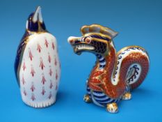 Two Royal Crown Derby paperweights one in the form of a penguin the other in the form of a dragon
