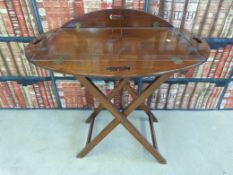 A 19thC mahogany butler's tray on stand