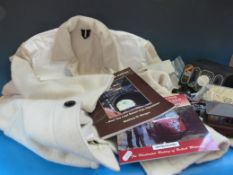 A white felt high visibility railway tunnel coat together with 1934 GWR book 