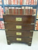 A campaign style bedside chest of four drawers (W46cm x D31cm x H63cm)