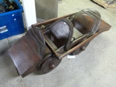 A large Eastern hardwood child's carriage with seats,