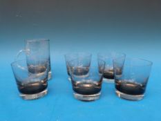 A glass whisky set with jug and five glasses,