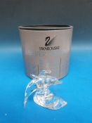 Swarovski crystal model of a dolphin leaping through waves in original box