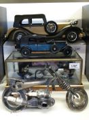 A Franklin Mint Rolls Royce Silver Ghost with paperwork, in glass display case,