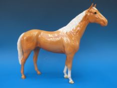 A large Beswick palomino racehorse