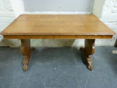 A satinwood library table with moulded edge,