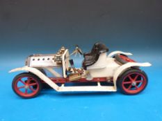 An early version Mamod steam car with water level plug and artillery style wheels