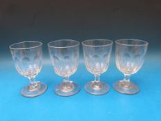 Four Georgian cut glass rummers with faceted bowls and raised on octagonal stems, 14cm tall.