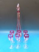 A flash overlaid cut glass decanter, 46cm tall, and six matching glasses, 15cm tall.
