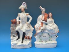 A Staffordshire figure of Napoleon together with a figure of a piper and Victoria and Albert