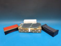 Three Swarovski crystal display stands (two in original boxes)