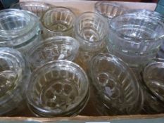 A large quantity of glass jelly moulds