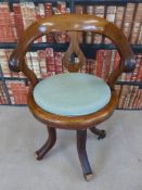 A vintage oak swivel office or captain's chair