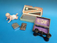 A silver vesta case with mermaid to front together with a cased pair of opera glasses, lighter,