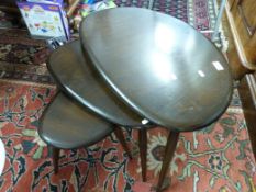 An Ercol nest of three pebble tables