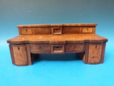 A 19thC apprentice walnut pedestal sideboard opening to reveal a fitted jewellery box,