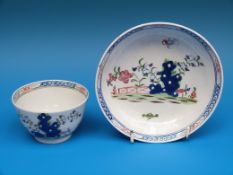 An 18thC teabowl and saucer decorated in enamel possibly Lowestoft