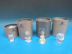 Four Swarovski crystal owls all with gem set eyes and in original boxes