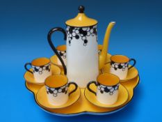 A Royal Worcester Art Deco coffee set on pedestal tray (puce Worcester stamp)