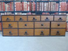 A 19thC oak and mahogany haberdashery or seed chest of thirteen drawers,