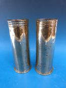 A pair of trench art WWI shell cases engraved with oriental decoration