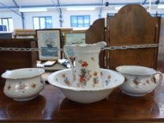 A Burleigh Ware toilet set decorated with flowers (five pieces)