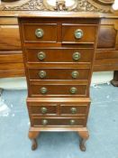 A small tallboy style chest of drawers, the top fitted two over three drawers,