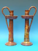 A pair of 19thC / 20thC salt glazed pottery candlesticks in the Arts and Crafts Sir Christopher