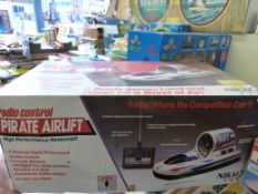 A boxed Fuhai hovercraft with radio control,