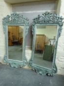 Two ornate framed mirrors with bevelled glass,