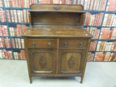 A small oak sideboard with gallery (W107, D57,