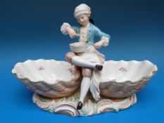 A Meissen figural double sweetmeat dish with a boy eating from a saucepan.