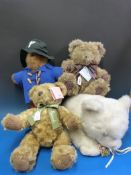 Four various bears one Paddington, one from Harrods,