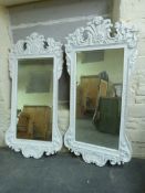 Two ornate framed mirrors with bevelled glass,