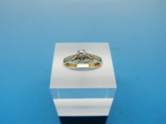 An 18ct gold ring set with a diamond