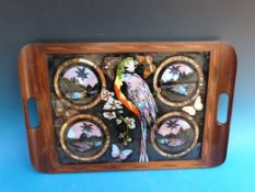 A c1920s hardwood tray with butterfly wing decoratopm depicting tropical views and a parrot