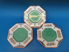 Six Art Deco style plates hand-painted in the manner of Clarice Cliff, signed to reverse M.