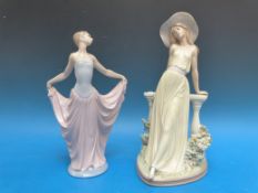 Two Lladro figures comprising a lady wearing a hat and leaning on a balustrade and a dancer