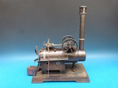 A Doll overtype steam engine with twin flywheels, single double action cylinder,