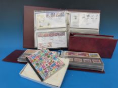 A collection of first day covers in albums