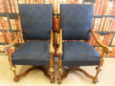 A pair of William and Mary style mahogany upholstered armchairs