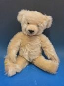 A Merrythought blonde mohair bear with jointed limbs and shaved snout, 37cm tall.