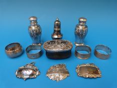 A tortoiseshell and white metal repoussé decorated trinket box together with four hallmarked silver