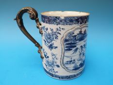 An 18thC Chinese blue and white export tankard with metal handle of the same period (16cm tall)
