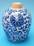A 19thC or earlier Chinese blue and white tea poy with stylised scrolling floral decoration
