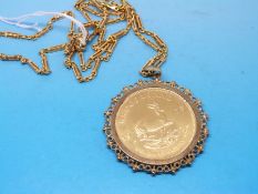 A 1973 gold full Krugerrand in a mount marked 9ct (38.