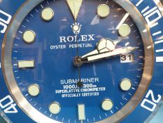 A Rolex advertising clock in Submariner style