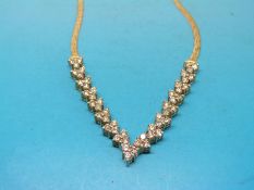A yellow metal necklace marked 14ct set with 51 diamonds,