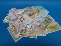 Fifty various world bank notes, including Saddam Iraqui, Zambia, Afghanistan, Myanmar etc,