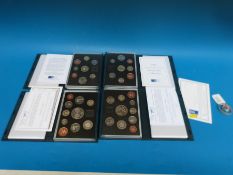 Four UK proof coin collections by The British Royal Mint in deluxe cases, comprising 1994, 95,